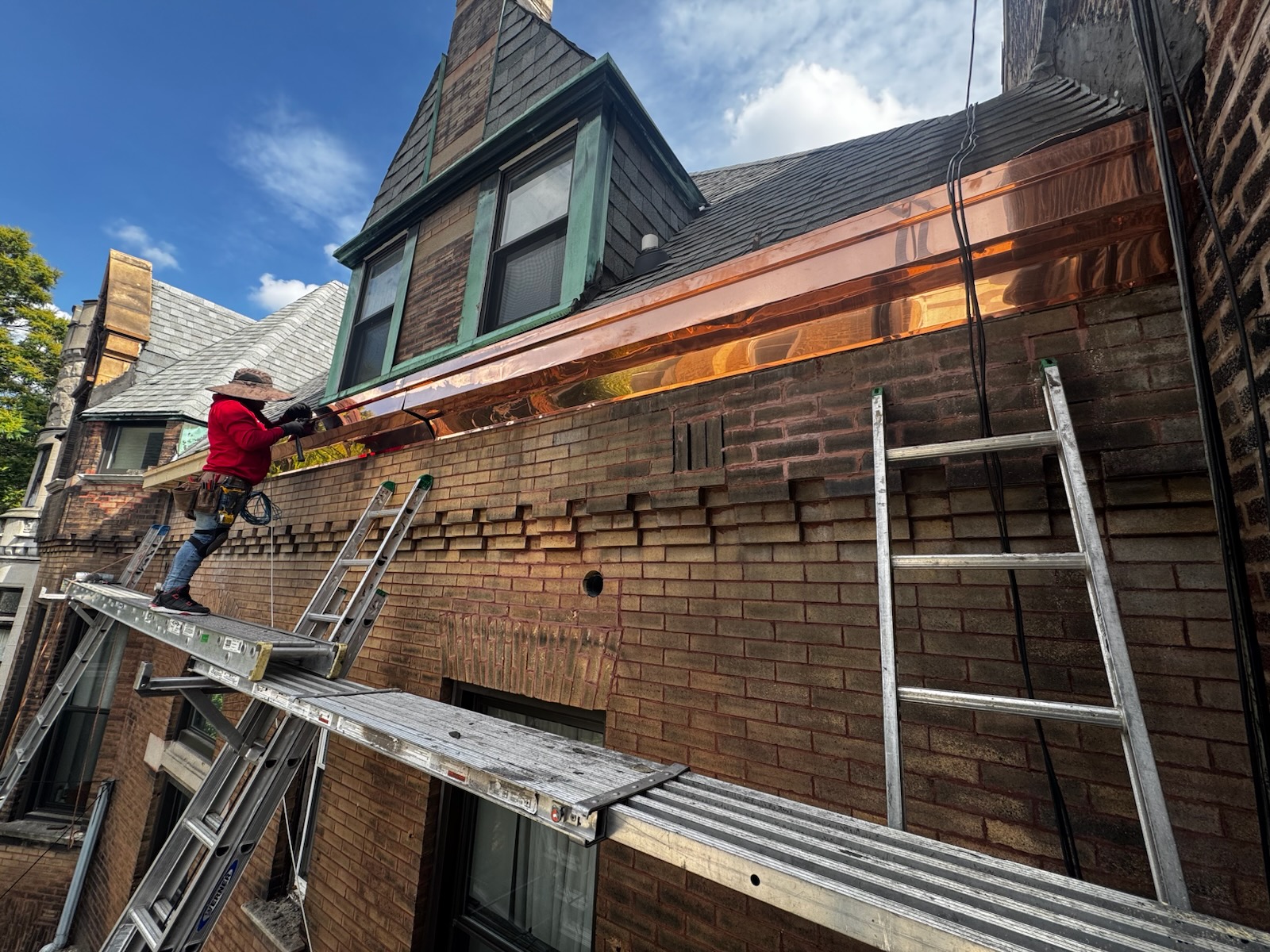 Copper gutter replacement in Chicago with custom copper downspouts